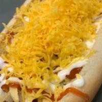 Hotdog / Perros · Topped with cole slaw, corn, potato sticks, freshly shredded cheese, ketchup, mayonnaise and...