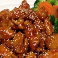 Sesame Chicken · Deep-fried battered chicken with house special honey sauce and topped with sesame seeds.