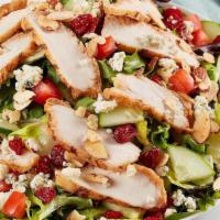 Savannah Chopped Salad · Grilled chicken, dried cranberries, Gorgonzola, honey roasted almonds, tomato and cucumber o...