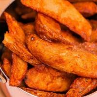 Masala Fries · House-made potato wedges with fresh ground spices and herbs. Served with your choice of dipp...