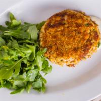 Lump Crab Cake · Crab, crab and more crab! Served with lemon aioli, garnished with baby arugula and almonds.