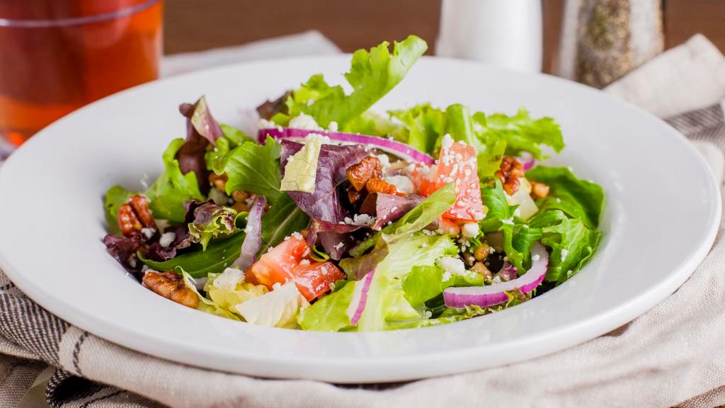 House Salad · Tomatoes, candied pecans, bleu cheese, red onion, spring mix, white balsamic vinaigrette.