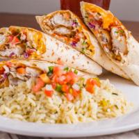 Serafin'S Fish Tacos · Fried tilapia, tangy cabbage, pico de gallo, shredded cheese and ranchero sauce, rolled in f...