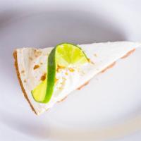 Key Lime Pie · A cool tangy lime custard with sweet whipped cream on top, traditional graham cracker crust.