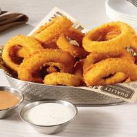 Gourmet Onion Rings · Jumbo sweet Spanish onions, thick-cut & lightly breaded in a gourmet crumb & fried until cri...