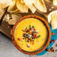 Chips & Queso · Three-cheese queso topped with fresh pico de gallo and served with crispy tortilla chips.