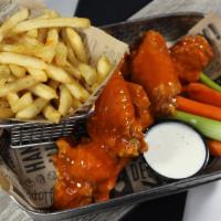 Boneless Wings And Fries · Boneless wings tossed with your choice of sauce.  Served with seasoned fries,  carrots, cele...