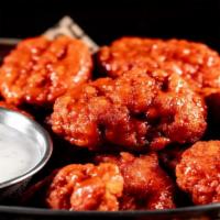 Boneless Wings · Boneless wings tossed with your choice of sauce.  Served with carrots,  celery and choice of...