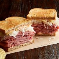 Reuben The Great With Pastrami Regular · 1/2 pound of hot pastrami, Swiss, sauerkraut, 1000 Island dressing, on toasted marbled rye. ...