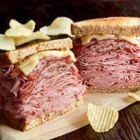 The New York Yankee (1100 Cal) · 3/4 pound combination of hot corned beef and pastrami, Swiss on toasted rye.