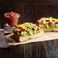 Texacado Toast  (630 Cal) · Featuring a toasted Telara Bun, topped with Guacamole, Corn and Black Bean Salad, Melted Che...