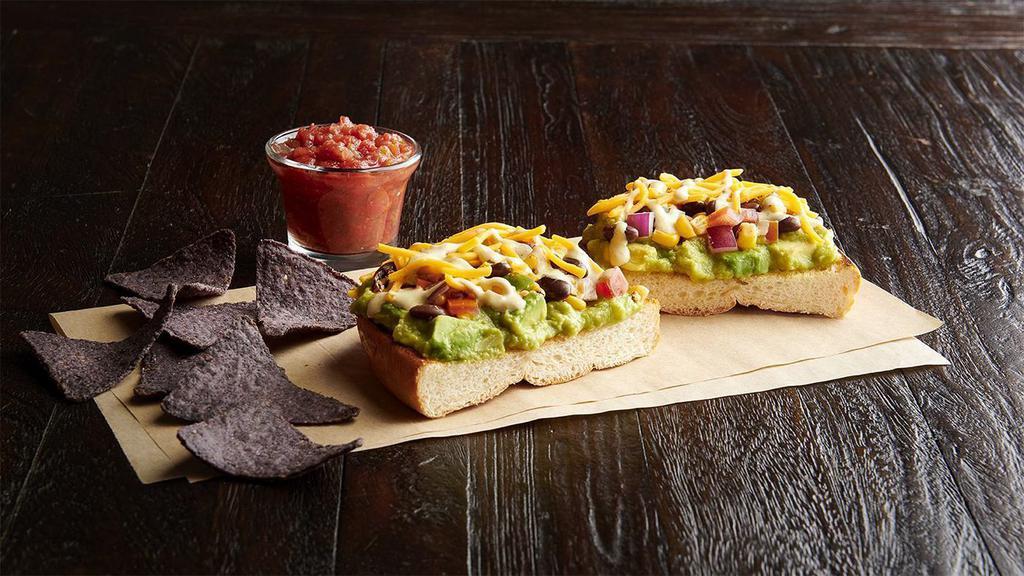 Texacado Toast            · Fresh avocados, roasted corn and black bean mix, cheddar, jalapeño ranch, on toasted Mexican-style bread with salsa. Served with blue corn chips and salsa.