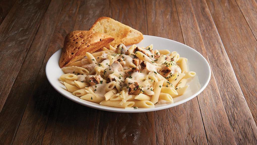 Chicken Alfredo · 1170/690 cal (bread: 230/120 cal) Penne pasta topped with  grilled 100% antibiotic free chicken breast, creamy Alfredo sauce, Asiago. Served with toasted herb focaccia bread.
