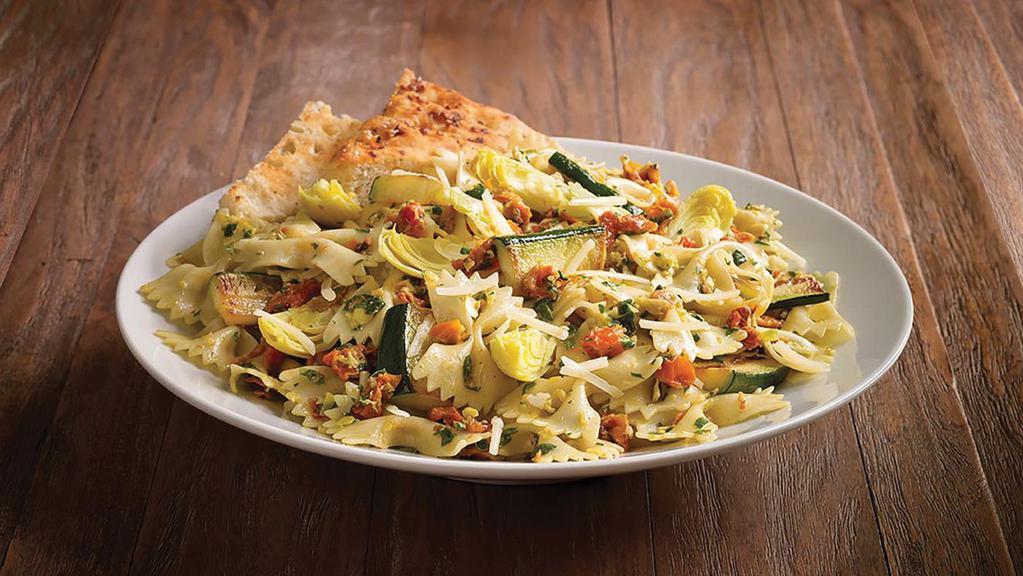 Zucchini Garden Pasta Original · Penne pasta, roasted zucchini, fresco mix of roasted tomatoes, organic spinach, artichoke hearts, Asiago. Served with herb focaccia.