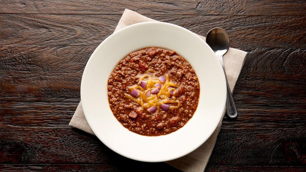 Bowl Chili  · With chunks of lean ground beef, lots of fresh herbs and spices in a thick and robust tomato-based sauce, 