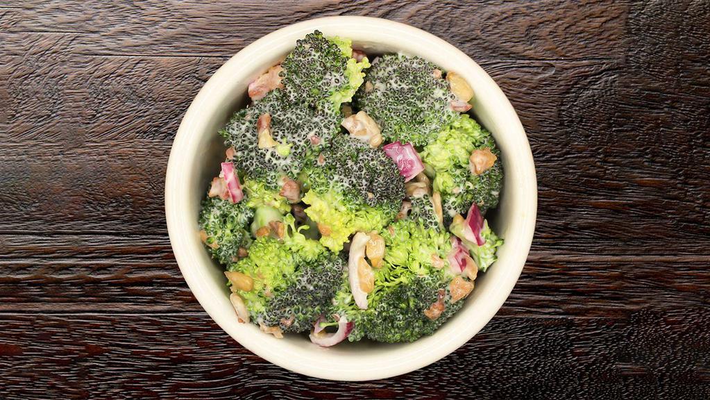 Broccoli Salad  · Our house-made recipe combines broccoli florets with bacon bits, sunflower seeds and diced red onion with a creamy red wine vinegar dressing.