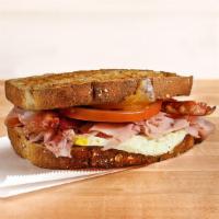 Breakfast Club (580 Cal)           · Fresh-cracked egg, nitrite-free ham, crispy bacon, melted cheddar and Swiss, tomato, on toas...