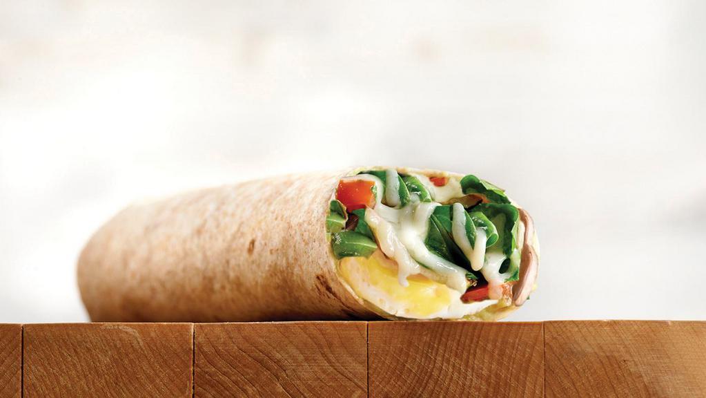 Breakfast Veggie Wrap · Organic wheat wrap filled with fresh-cracked eggs, mushrooms, organic spinach, our fresco mix of roasted tomatoes, organic spinach, artichoke hearts and Asiago.
