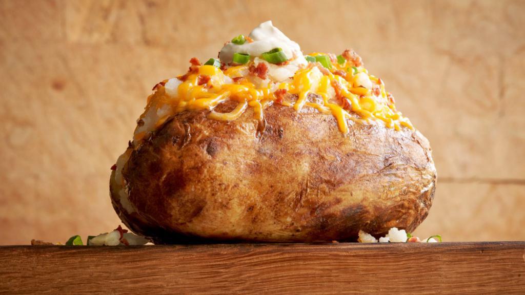 Family Jane Bar      · Giant baked potatoes wrapped hot and ready to serve. Toppings: cheese, sour cream, bacon, butter, and green onions. Served with four chocolate chip cookies. (Serves 4)
