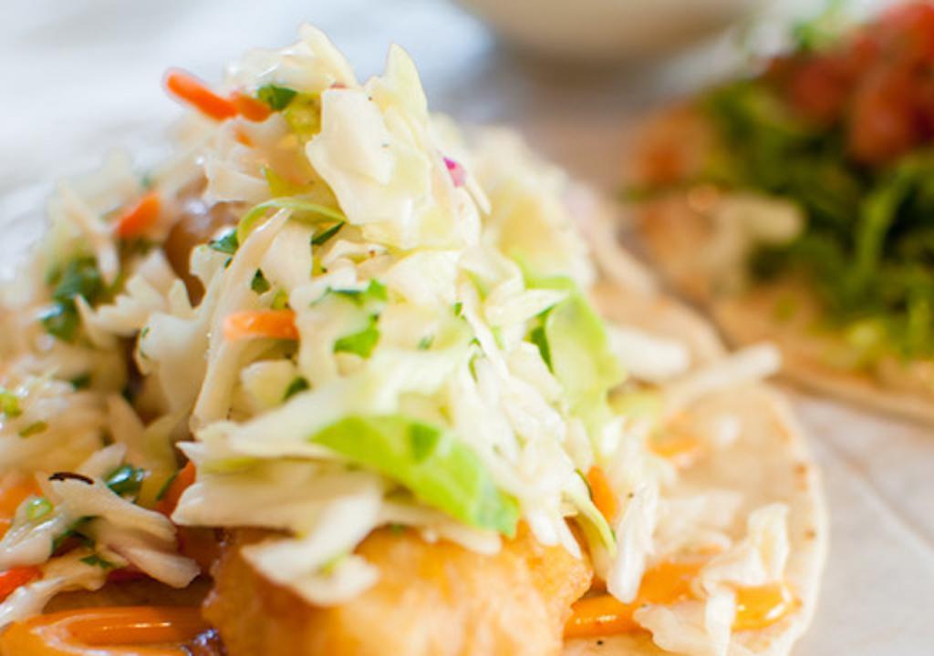 Baja Taco
 · Tempura fried fish topped with Asian slaw, cilantro, and spicy sriracha mayo.