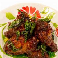 Chicken Wings(5 Pcs) · Chicken mixed wings marinated with Thai herbs and spices deep fried to perfection tossed in ...