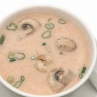 S02-Small-Tomkha Soup · Spicy and sour coconut milk soup simmered with galangal, lime leaves, lemongrass, mushroom a...