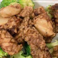 Squid And Brocoli · Deep fried pieces of squid tossed in brown gravy sauce with steamed broccoli