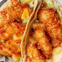Coconut Shrimp Tiki Taco · Our popular coconut crusted jumbo shrimp is paired with diced pineapple on a bed of tangy co...