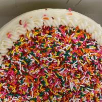 Birthday Layer Cake · Multicolored sprinkles are baked into this cake and then added on top. It's fun. It's festiv...