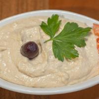 Hummus · Vegetarian. Mashed chickpeas blended with fresh garlic and tahini.