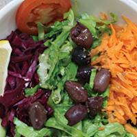 Mediterranean Salad · Chopped romaine lettuce, tomatoes, cucumbers, red onions and olives. Mixed with olive oil an...