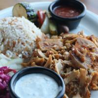 Chicken Döner (Gyro) · Slice chicken cooked on a rotating spit then thinly sliced, served with rice, lettuce and re...