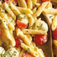 Penne Margherita · Shrimp or chicken in light cream sauce, fresh tomato, basil and green peas.