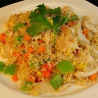 Pineapple Fried Rice · Stir-fried onion, egg, carrot, green onion, bell pepper and yellow curry served in fresh pin...