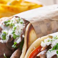 Lamb Gyro · Sliced lamb set on pita bread topped with lettuce, tomatoes, onions and tzatziki sauce.