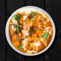 Creamy Butter Chicken  · Succulent pieces of chicken cooked in thick onion, tomato, and buttercream sauce with ground...