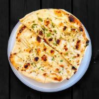 Basic Butter Naan · House-made pulled and leavened dough baked to perfection in an Indian clay oven and basted w...