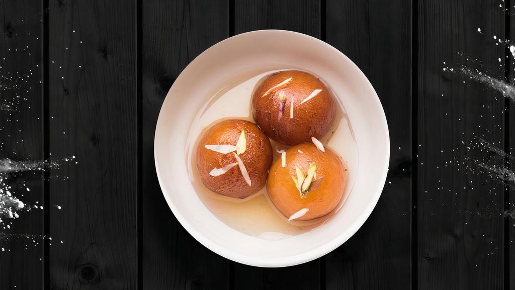 Juicy Gulab Jamun · Two pieces. Deep-fried dumplings soaked in sugar syrup with a dash of cardamom flavor.