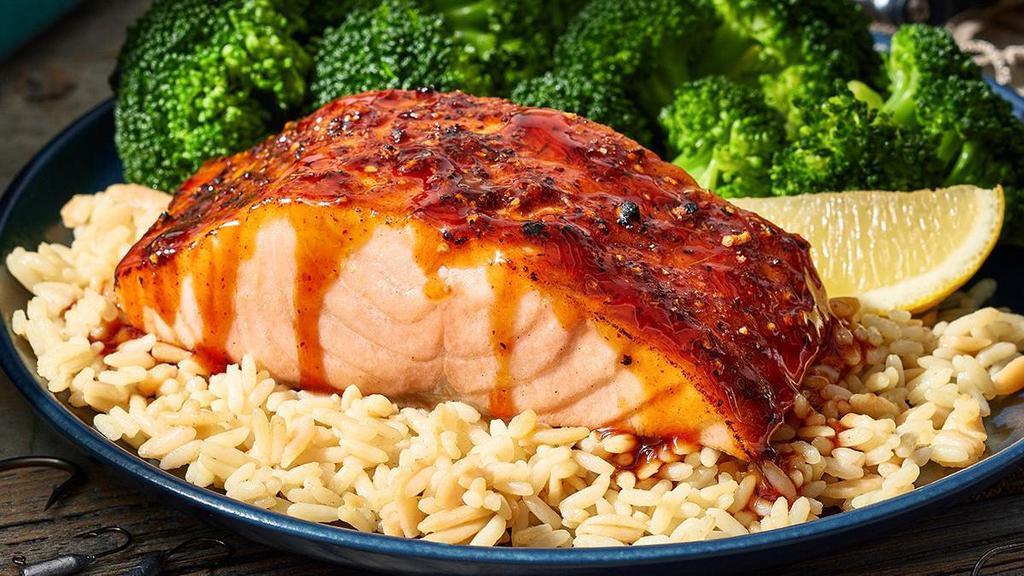 Bourbon-Glazed Salmon · A 6-oz. salmon fillet rubbed with a special herb seasoning and Charlie's favorite sauce, a kickin' bourbon glaze. Tucked nicely on a bed of rice and a side of broccoli.