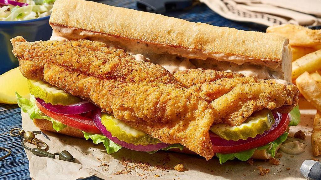 Cajun Catfish Po Boy · Fried strips of cornmeal-coated Mississippi Delta farm-raised catfish, this Po Boy is rich in flavor. Served with Cajun mayo, lettuce and tomato, onions and pickles on a toasted baguette. And fries and coleslaw, of course.