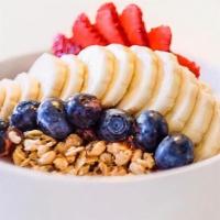 Organic Acai Bowl · acai berry blend topped with berries, banana, coconut flakes, cacao nibs and granola