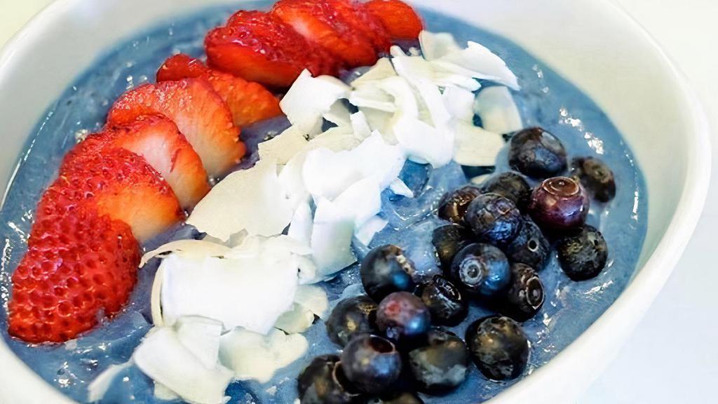 Blue Majik Bowl · blend of banana, mango, pineapple and Blue Majik, topped with strawberries, blueberries, chia seeds, coconut flakes, granola