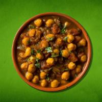 Spiced Chickpea Fiesta  (Vegan) · Delicious chickpeas cooked in an exotic blend of  Indian spices and garnished with cilantro ...