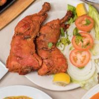 Tandoori Grilled Chicken Platter · Tender chicken cubes marinated overnight in exotic herbs and
spices, skewered on two bamboo ...