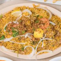 Chicken Biryani · Basmati rice cooked with boneless chicken with blend of Pakistani herbs, yogurt and spices. ...