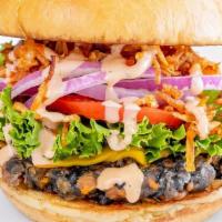 Veggie Burger · A special blend of our homemade black beans and sweet potato tots topped with American chees...