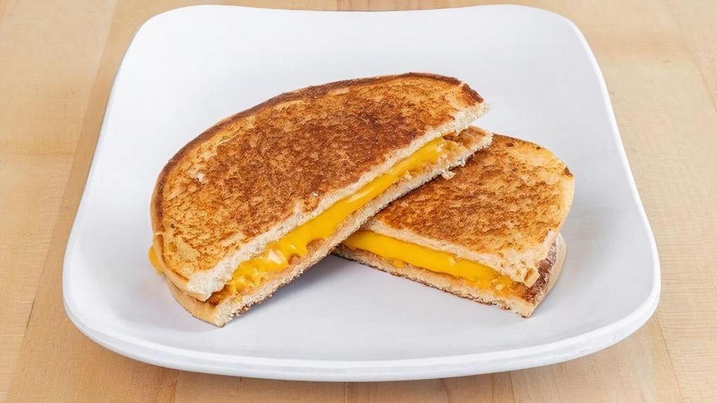 Kids Grilled Cheese · Three slices of American cheese melted between a toasted brioche bun.