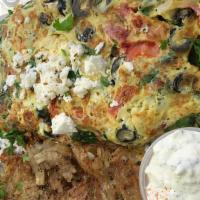 Greek Omelette · Eggs and omelette served with hash browns and pita bread.