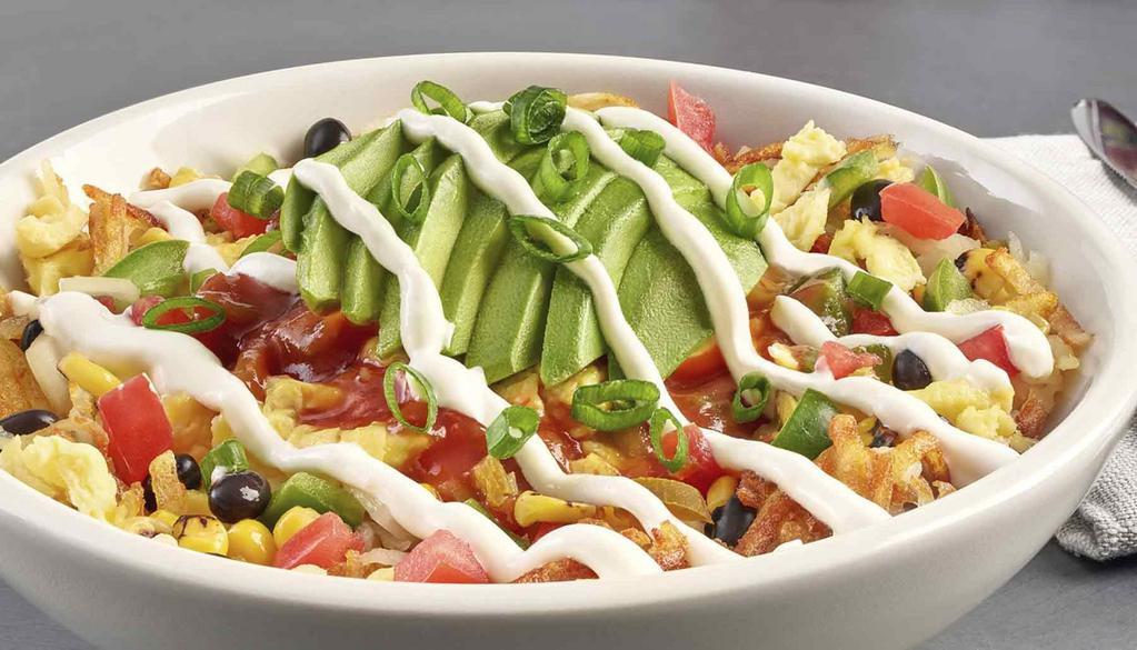 Southwest Scramble Bowl · Avocado, black beans, corn, diced green and jalapeño peppers, onions, tomatoes, scrambled eggs served over hashbrown potatoes, drizzled with salsa and sour cream, and topped with green onions.