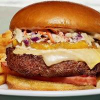 Hawaiian Burger · 100% Angus burger topped with grilled pineapple and ham slice, Swiss cheese, creamy coleslaw...